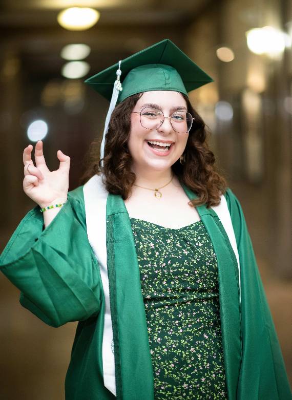 Daphne Lynd poses in commencement regalia