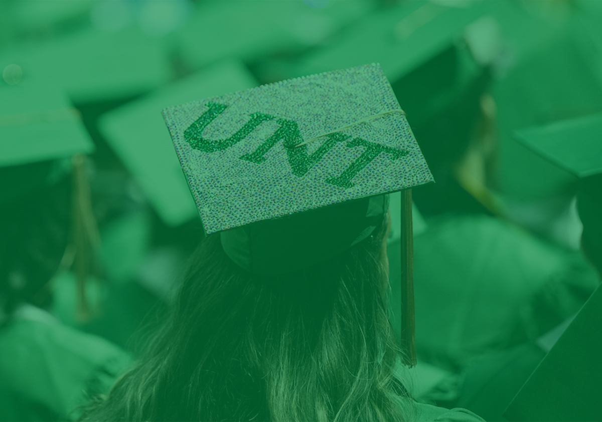 A graduate's UNT mortarboard decorated with jewels