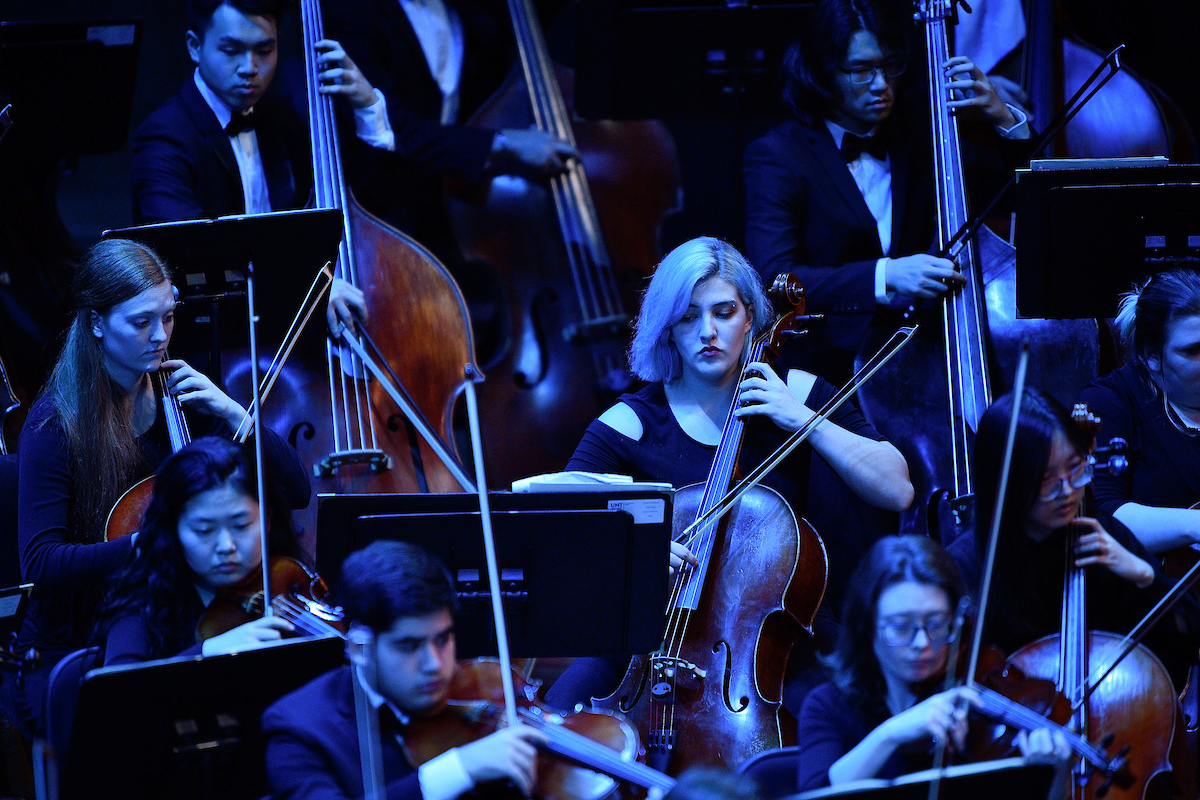 UNT concert orchestra in blue light