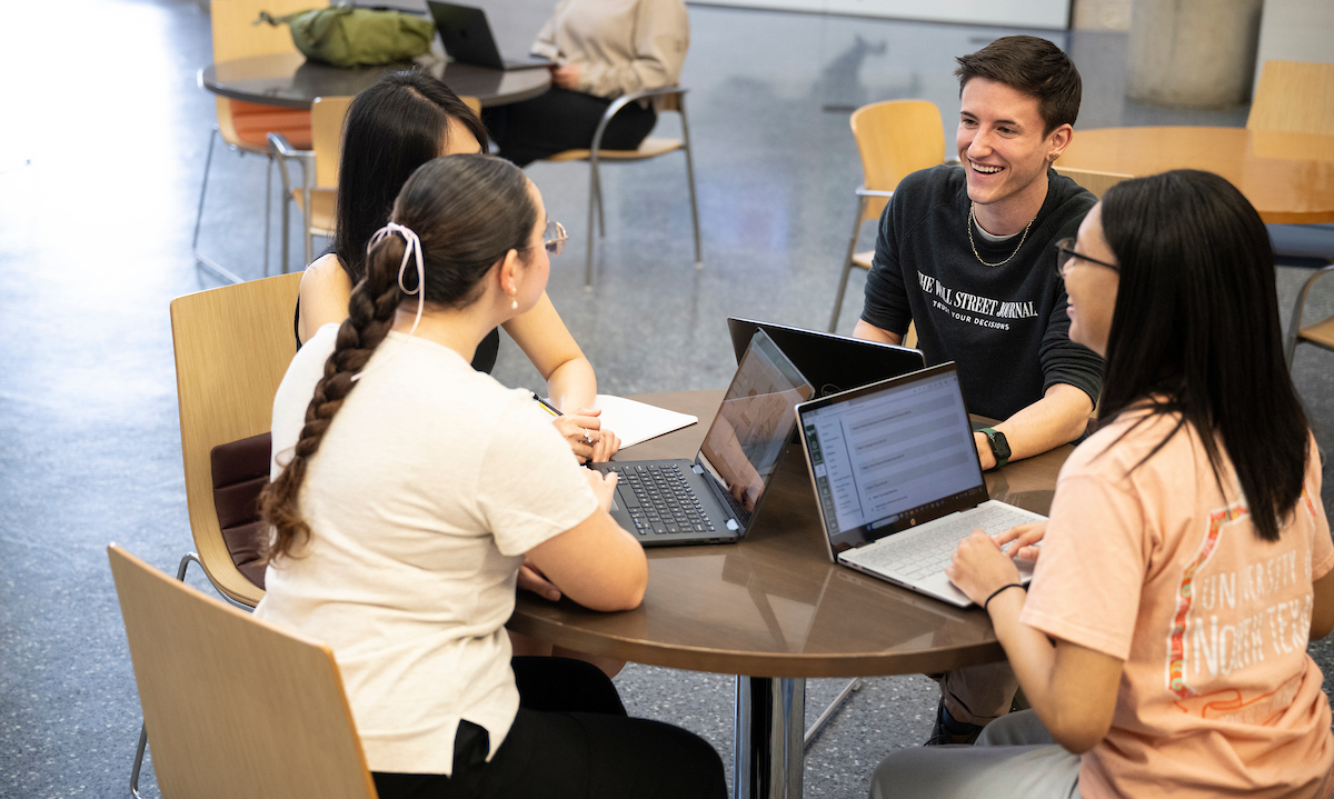 students working at laptops in the Business Leadership Building