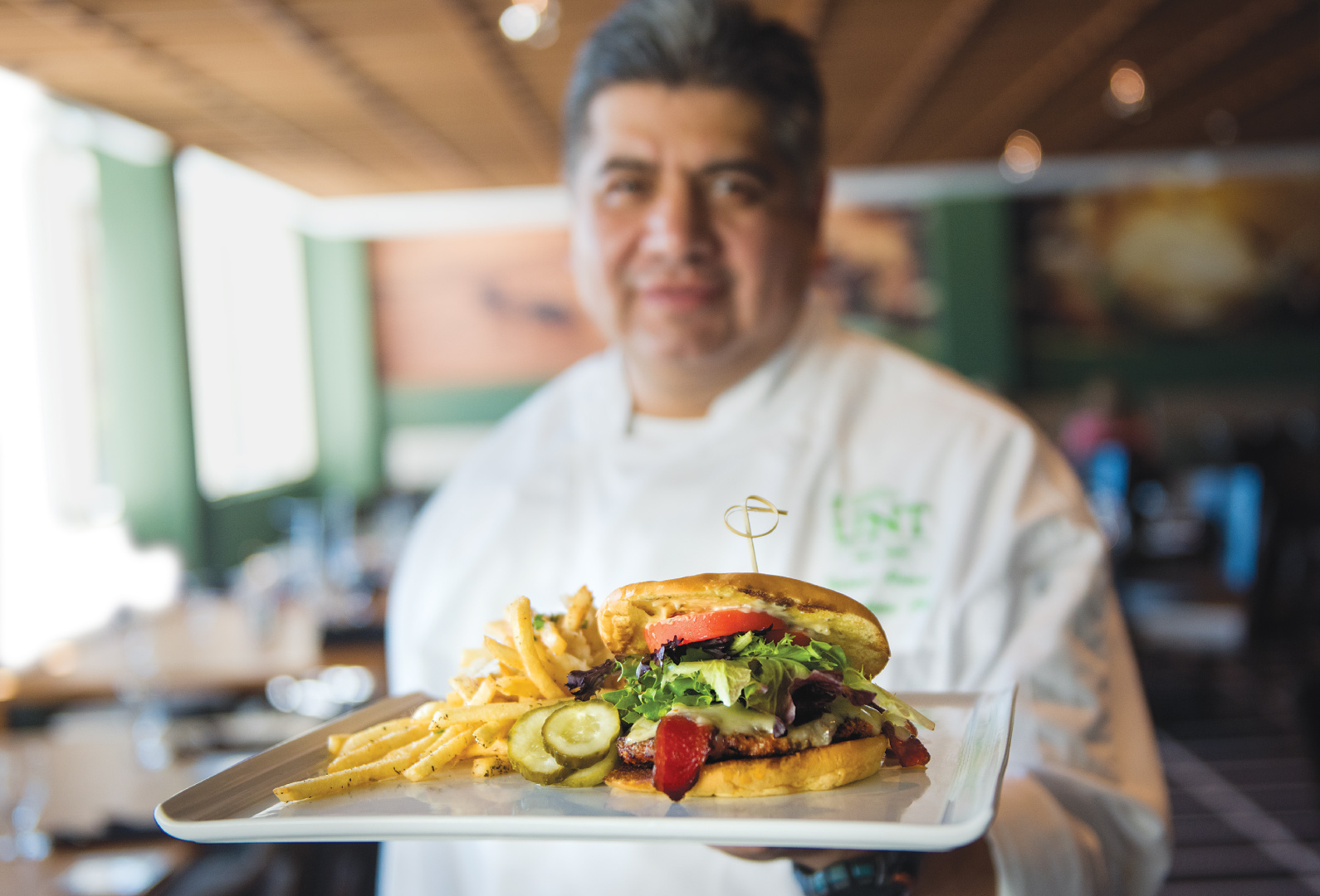 Chef holding a burger