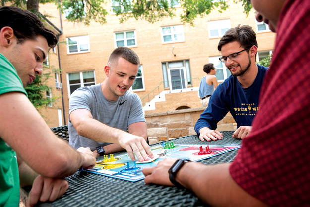 Students playing board games