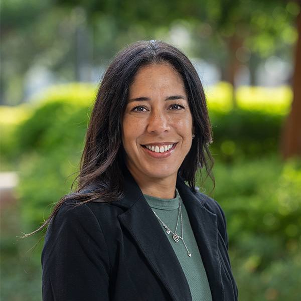 A woman wearing a black blazer.