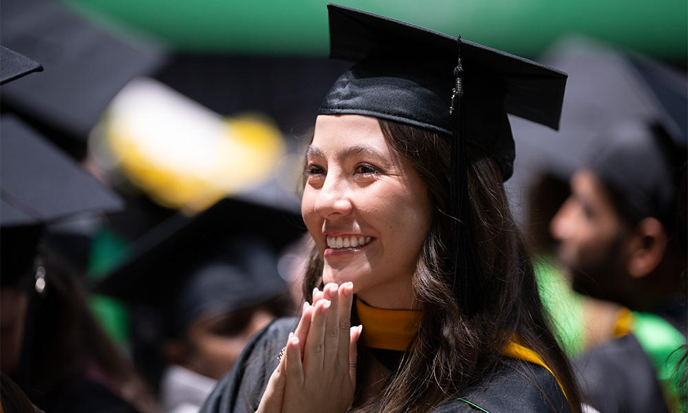 Lone graduating girl smiling 