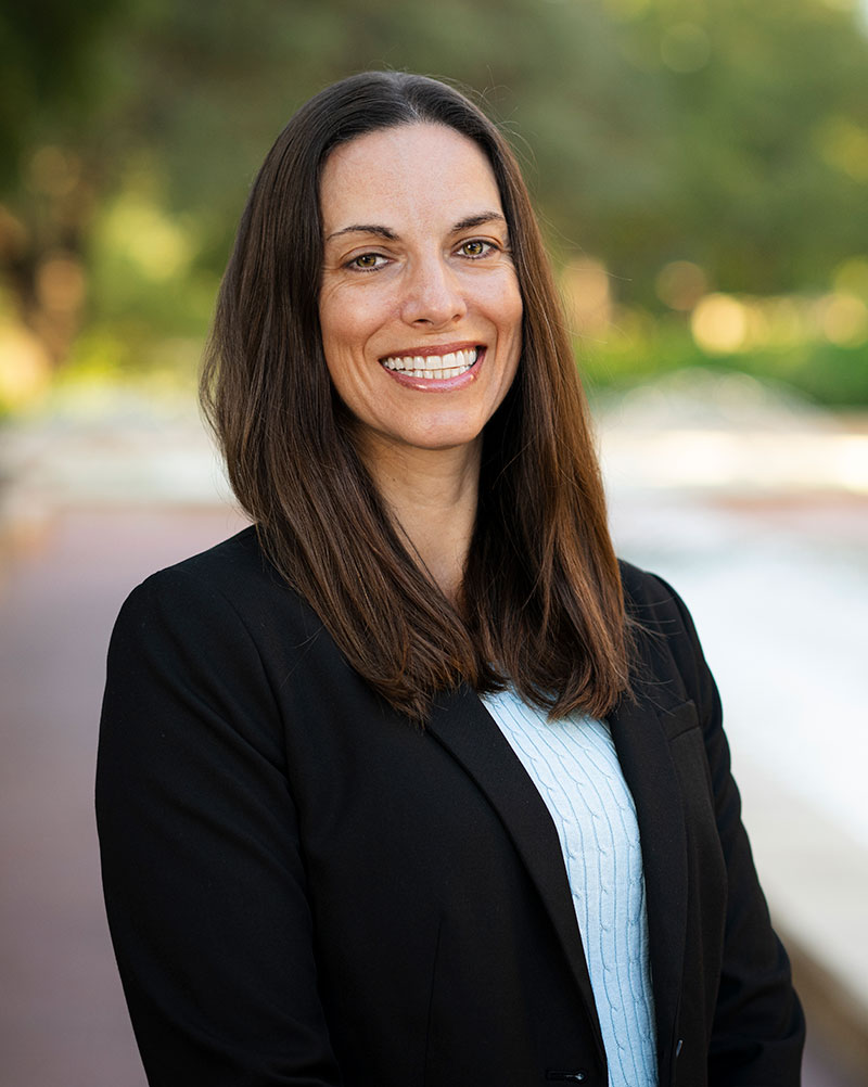 Laura Smith in a black jacket near a fountain