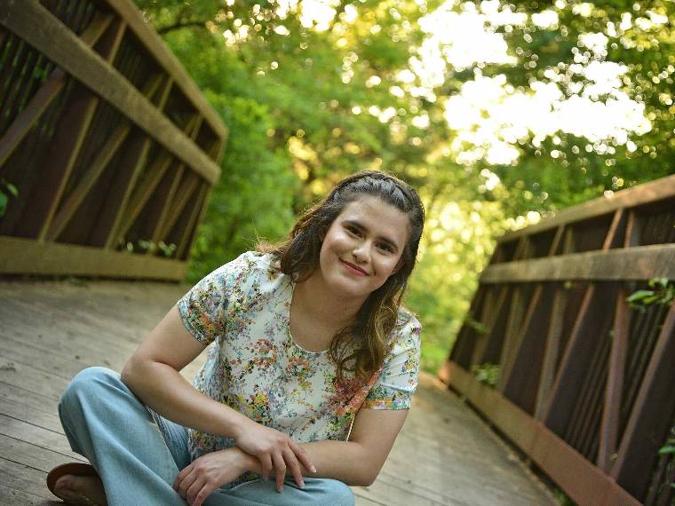 Stacy Gentry poses on a bridge.