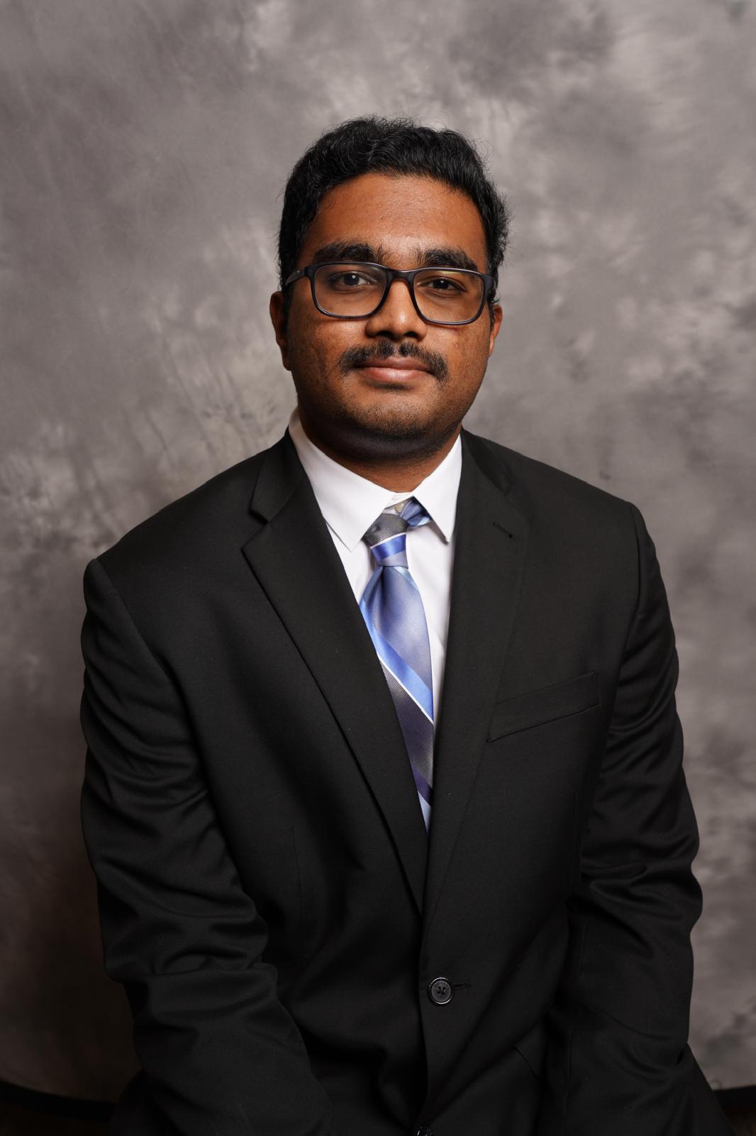 Ajay poses in formal attire