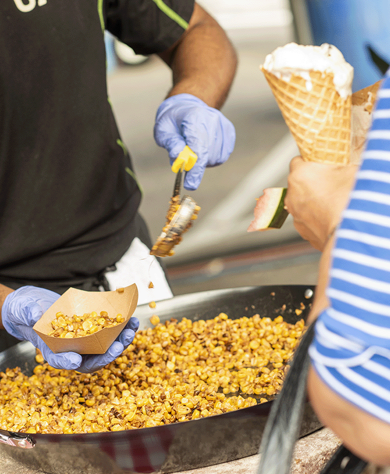 Staff serving elote and ice cream