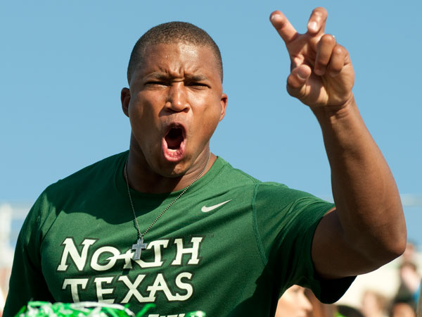 UNT student making an Eagle Claw