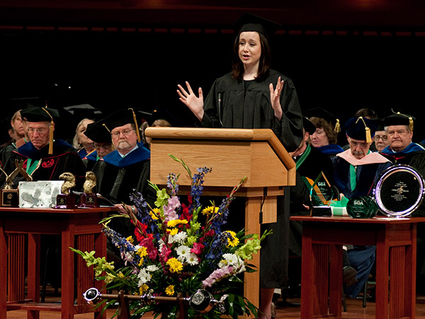 Person Speaking at a Podium