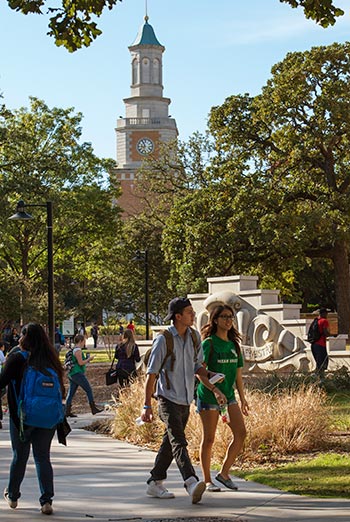 Students on campus in front of the Hurley Administration Building