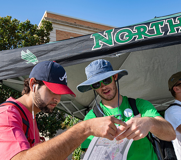 UNT students looking at a campus map. 