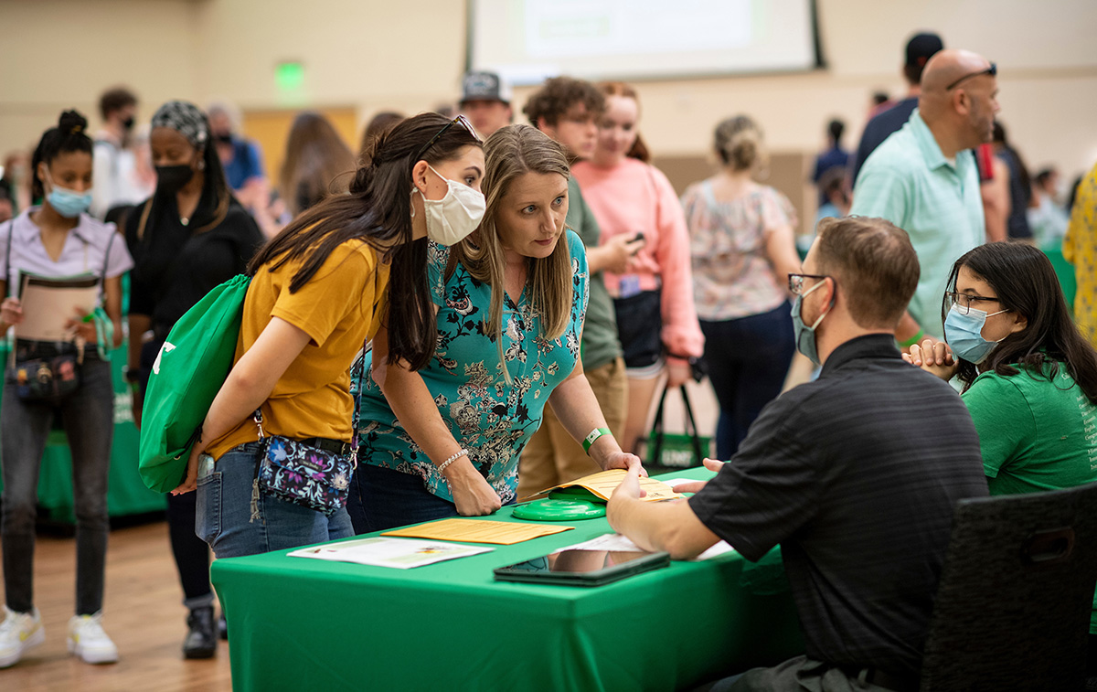 A parent and student at UNT Preview day getting assistance from the UNT admissions counselors.