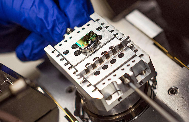 College of Engineering student working on electronic equipment in a lab.