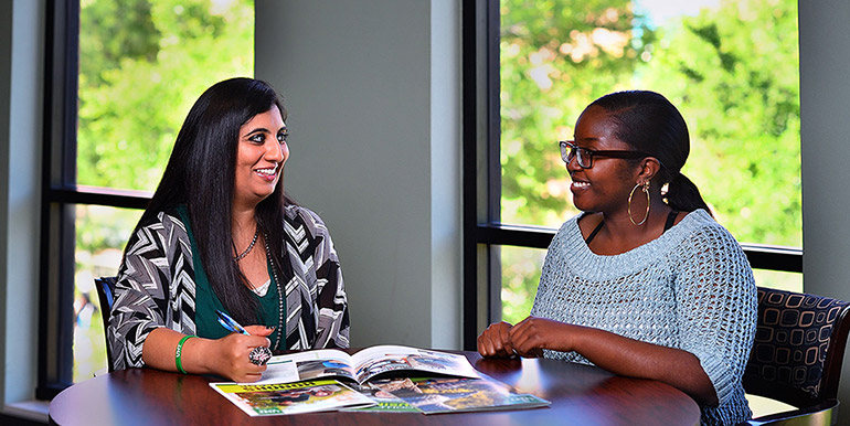 A student talking with a counselor