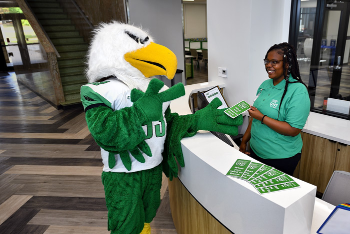 Scrappy talking to a UNT Student